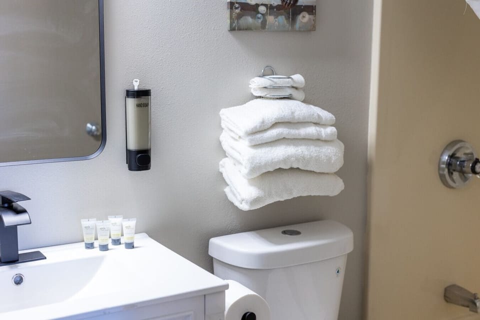 Clean, refreshed bathroom with fresh towels and essentials for a comfortable stay