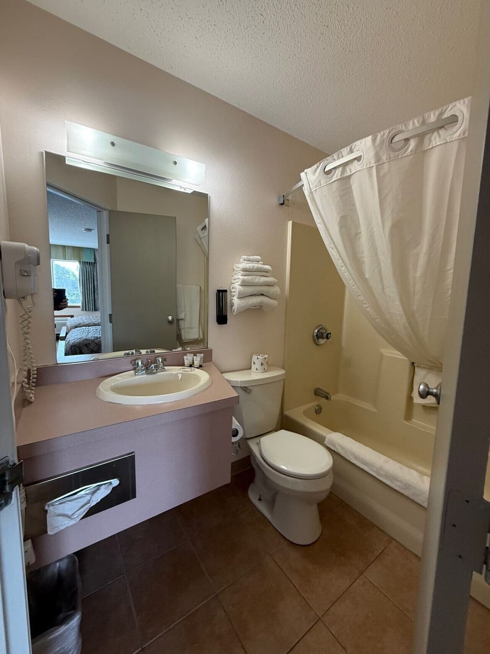 Well-maintained bathroom area offering fresh linens and updated vanity space.