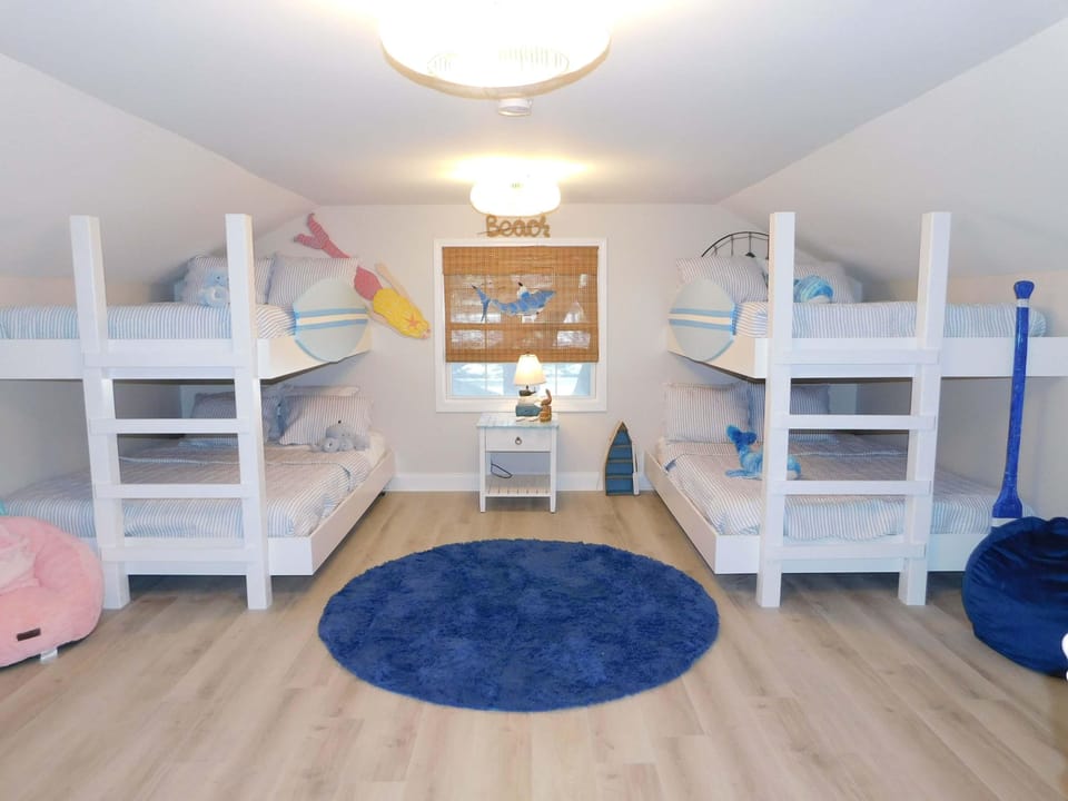 Bright, airy bunk room with cozy sleeping nooks and playful decor