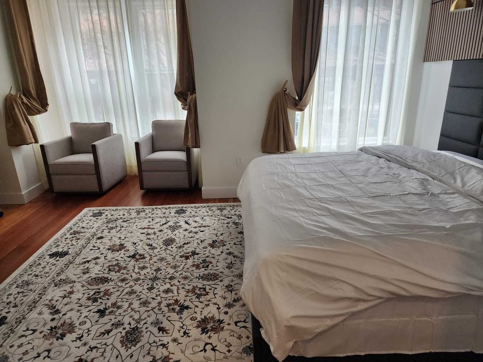 Warm and inviting bedroom with soft bedding and a calm atmosphere, perfect for unwinding and recharging at Dupont near Washington DC
