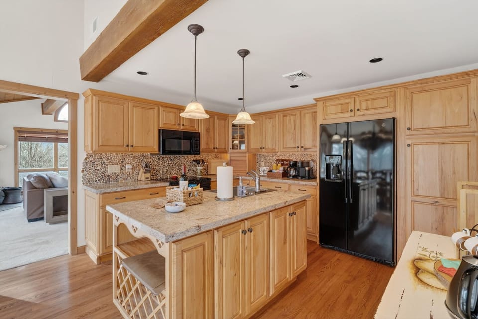 Enjoy a fully equipped kitchen with complete cookware and dining essentials, including wine glasses—plus dishwasher, microwave, stove/oven, refrigerator/freezer, toaster, and a fully stocked coffee bar & tea station.