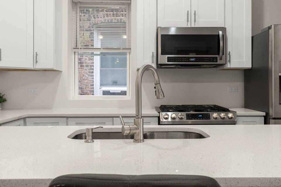 Stylish kitchen with modern fixtures and room for meal prep.