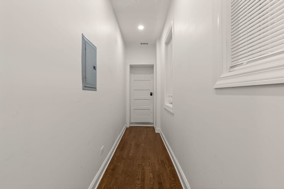A clean and well-lit hallway that contributes to the home's spacious layout.