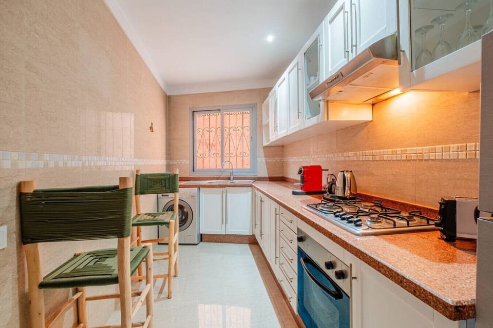 Fully equipped kitchen featuring stainless steel appliances, coffee maker, and all the essentials for home-cooked meals.