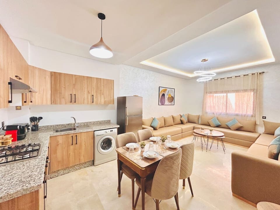 Relax in the stylish living room featuring elegant decor, a cozy sofa, and a smart TV for your entertainment.