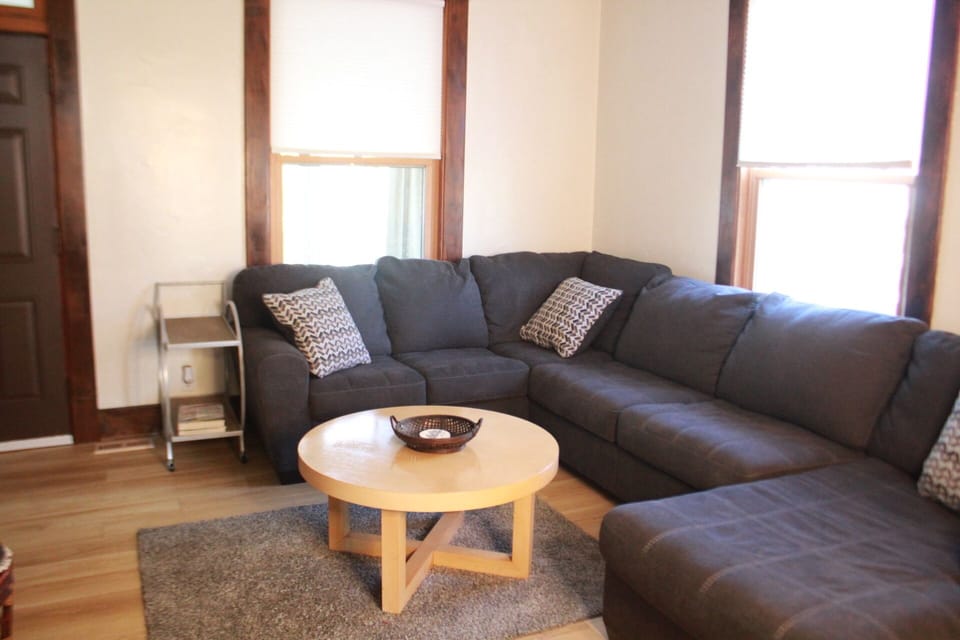 Living room, cozy couch with lots of room for everyone! 