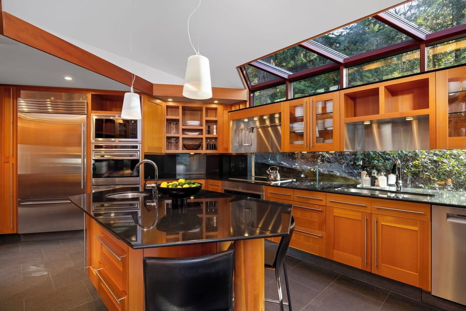 Your gourmet kitchen features premium appliances and stunning skylights creating a bright, inspiring space for culinary adventures.