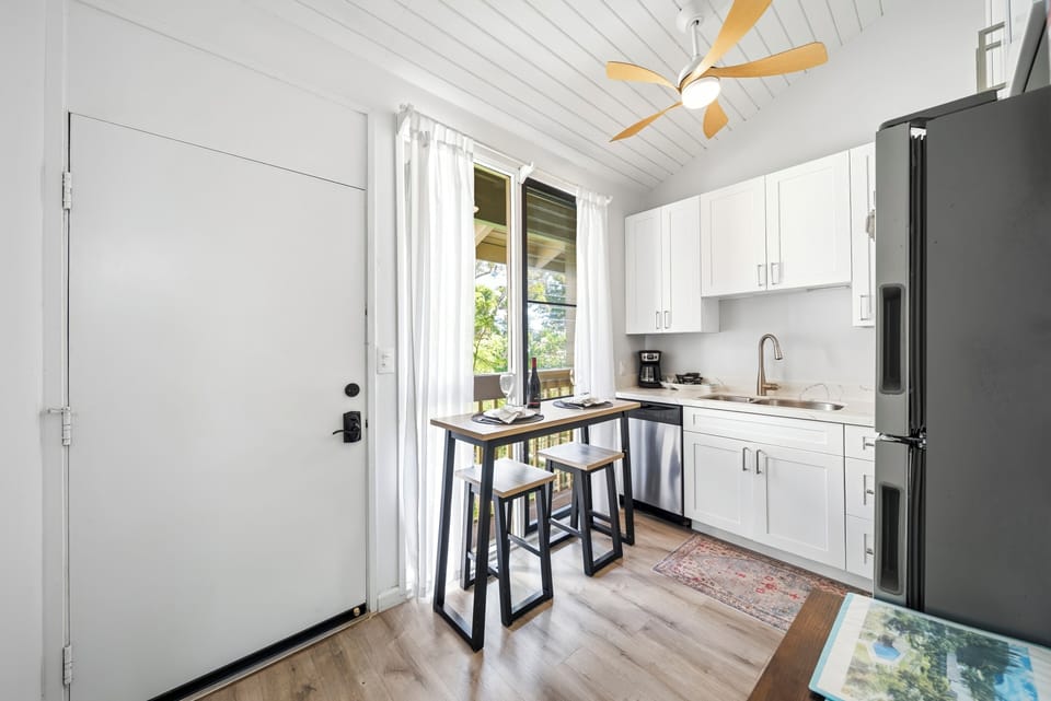 Two stools at the breakfast counter, the easy spot for morning coffee before the beach.