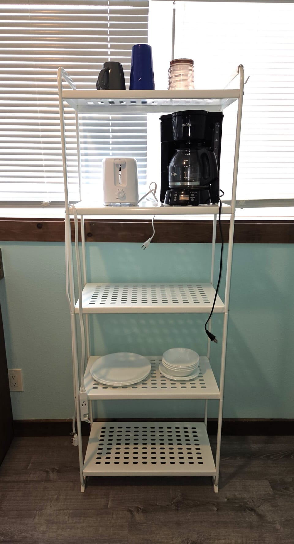 The bakers rack provides additional storage