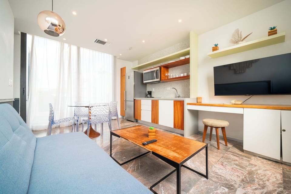 Deluxe Apartment, Balcony, Beach View | Living area