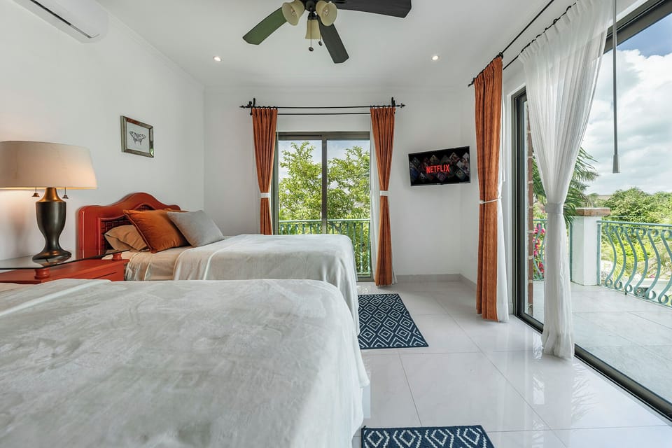 Twin bedroom with twin beds that can be made in a king. Private bath and balcony