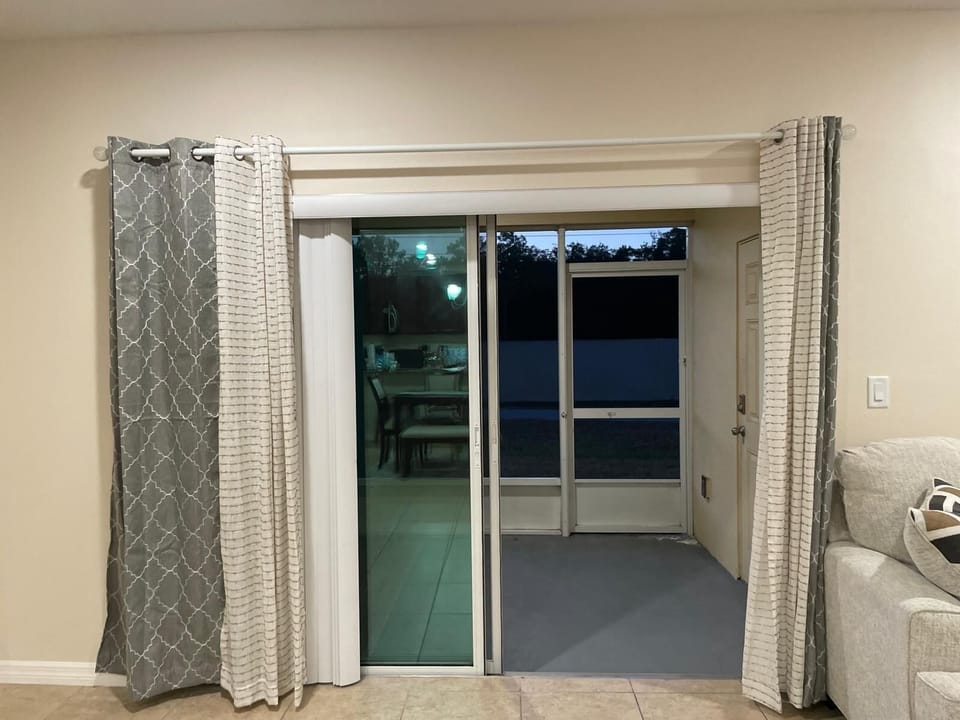 Enjoy the porch filled with natural sunlight — opens to walking trail