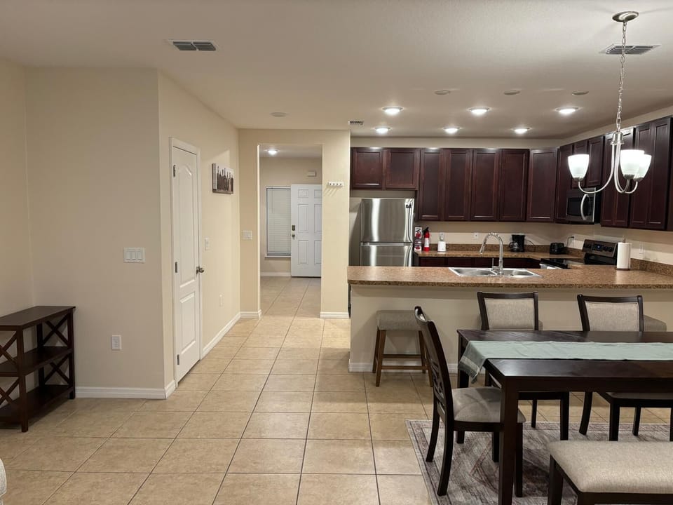 Bright and spacious kitchen with necessary amenities