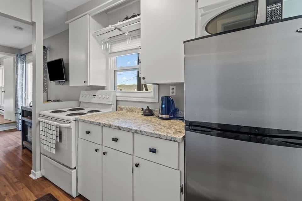 Fridge, Stove, coffee, microwave, slow cooker, pers blender, cutlery, utensils +