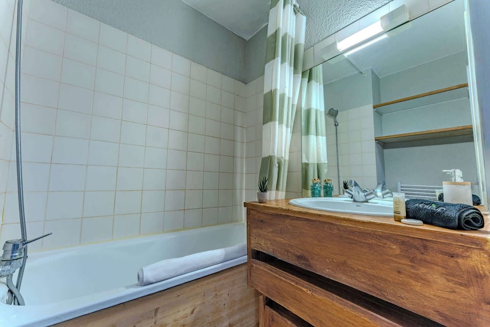 Clean, functional bathroom with relaxing hot shower after your mountain adventures.