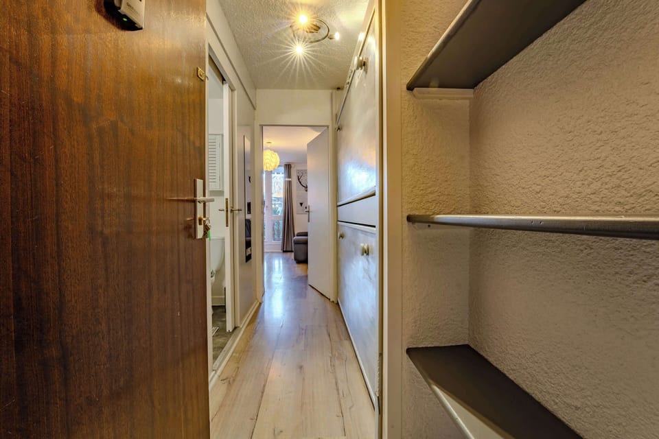 Welcoming hallway with smart storage and direct access to the cozy living area — perfect ski-in/ski-out base in the heart of Val Thorens.