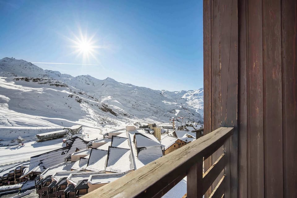 Private balcony with panoramic mountain views — enjoy the sun after a day skiing the slopes of Val Thorens.