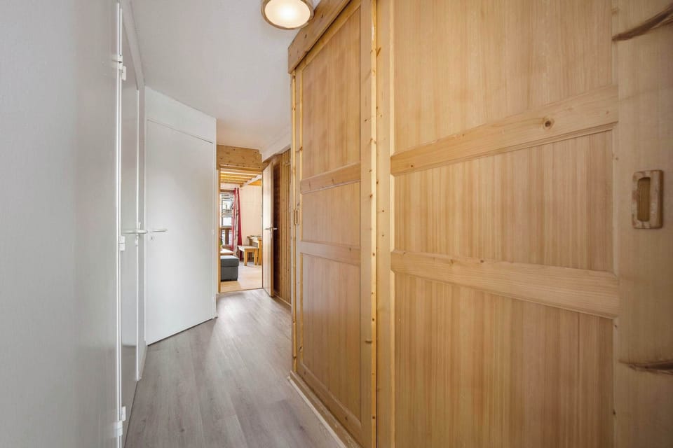 Warm wooden finishes welcome you into your ski-in/ski-out alpine retreat steps from the lifts.