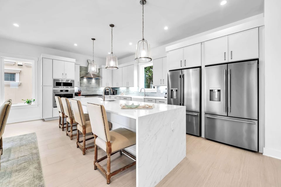 Gather in the beautifully designed kitchen, where high-end appliances and two refrigerators make cooking and entertaining effortless.
