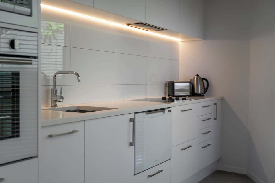 Self contained kitchen, with dishwasher, fridge / freezer, oven, cook top and microwave. 