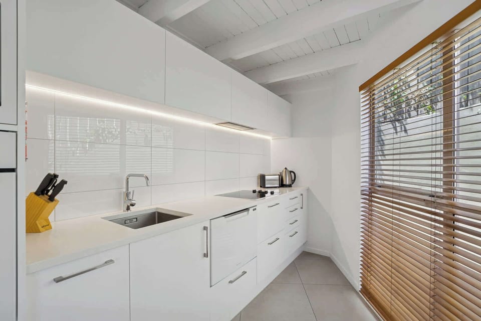 Self contained kitchen, with dishwasher, fridge / freezer, oven, cook top and microwave. 
