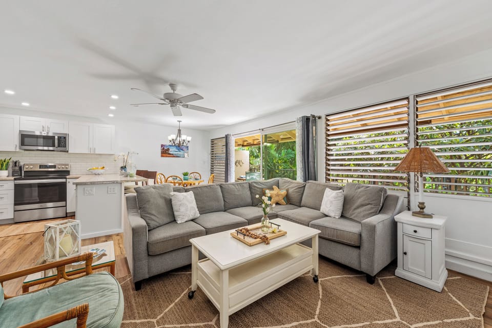 Kick back on the comfy sectional and soak in the natural light — perfect for movie nights or lazy afternoons.