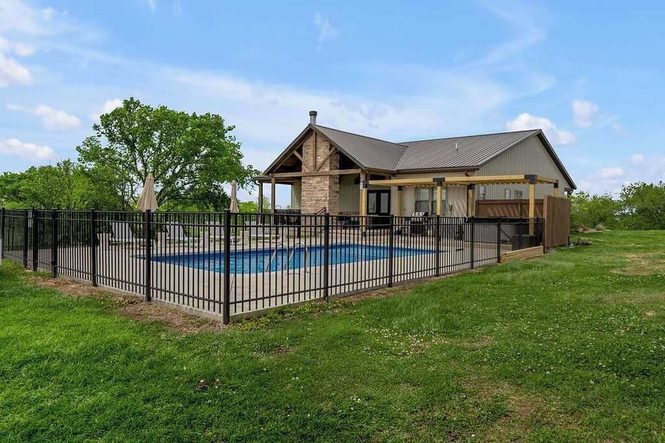 Walk the
fence line and take
in the pool and
open lawn — plenty
of space to spread
out the second you
arrive.
