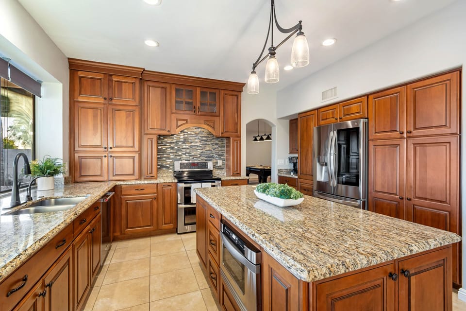 Fully Equipped Kitchen - Stainless Steel Appliances and Stone Counters