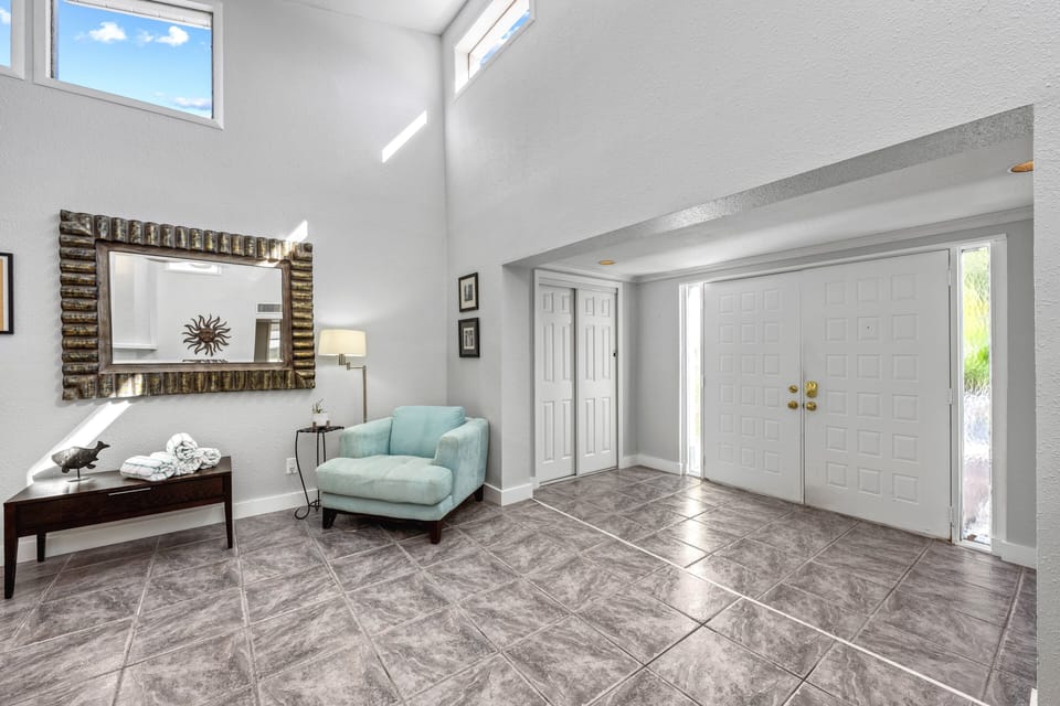Step into a bright, open foyer that sets the tone for your stay.