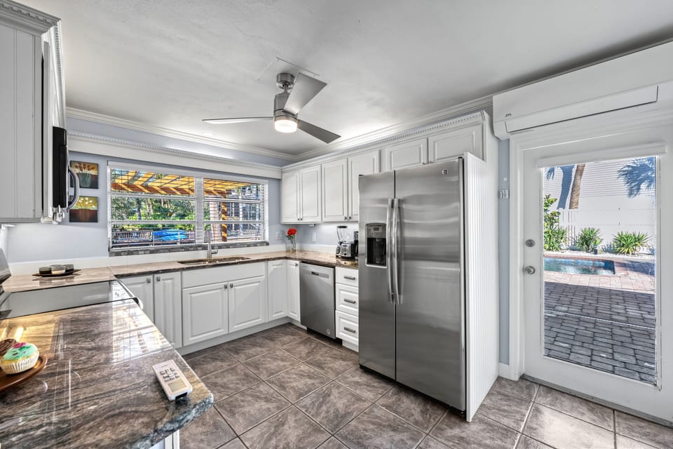 Just off the kitchen, the back door opens to your private backyard.