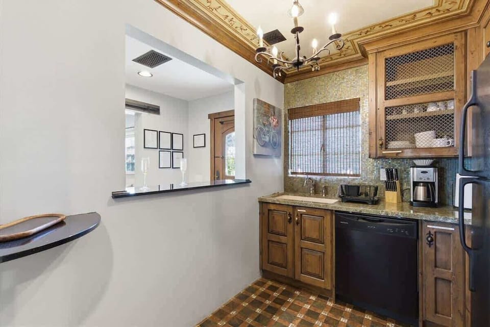 Unit 1: Inviting kitchen with modern appliances and bar seating for 2 guests.