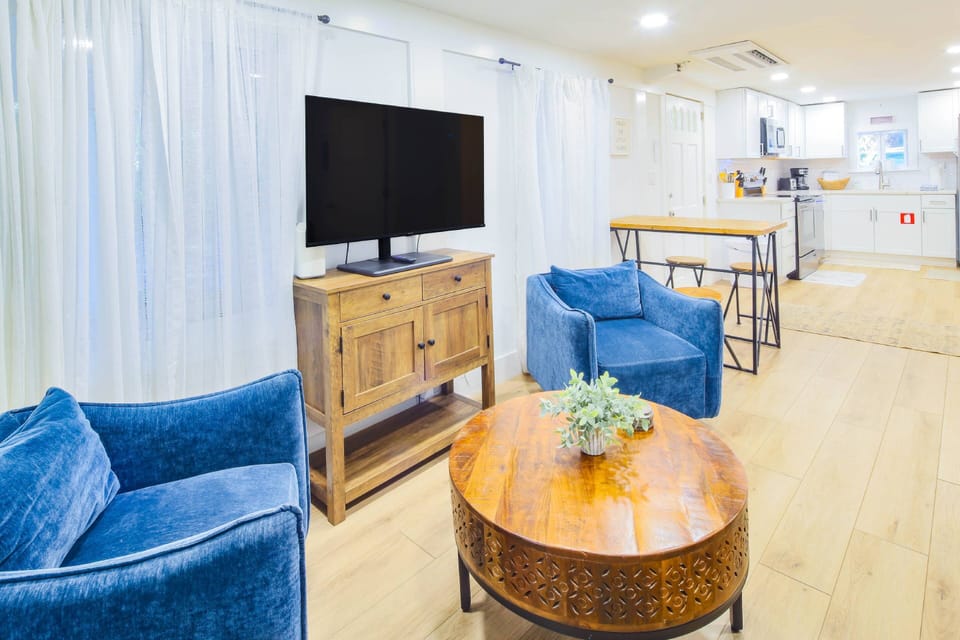 There is an open layout between the living room and kitchen.