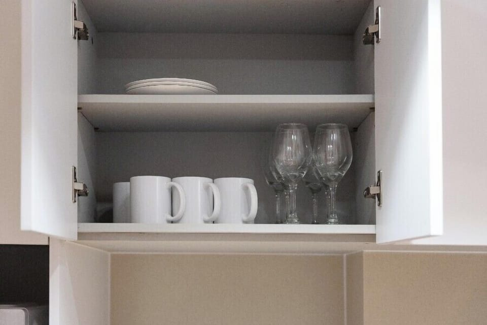 Premium Family Suite | Private kitchen | Fridge, microwave, highchair, cookware/dishes/utensils