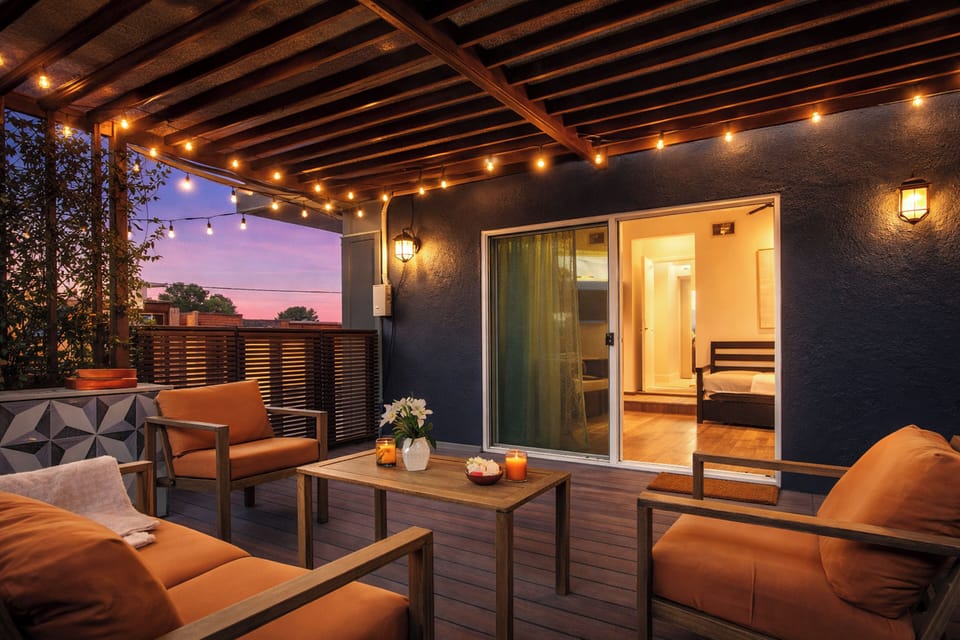 Relax outdoors in your covered patio with a grilling station, lounge seating, and a fireplace.