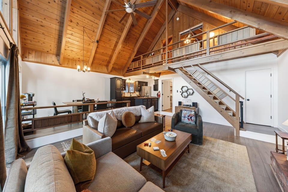 Inviting pull-out queen sofa perfect for relaxing by the wood-burning stove.