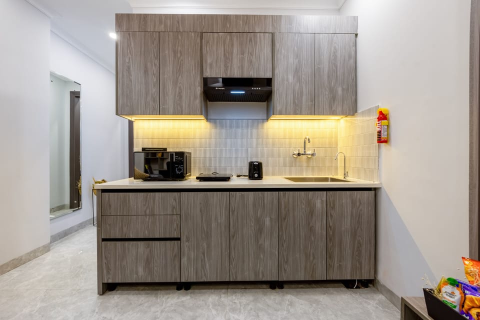 Luxury Suite | Private kitchenette | Full-size fridge, electric kettle, cookware/dishes/utensils