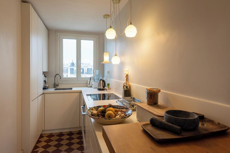 Bright open kitchen with Paris rooftop view