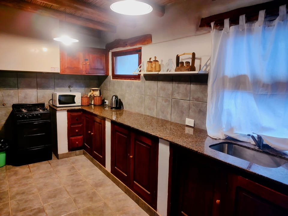 Family Room, Patio, Garden View | Private kitchen