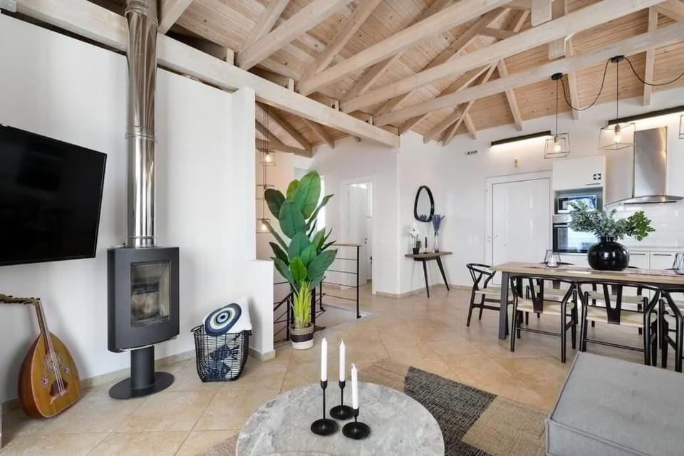 Deluxe Villa, Sea View | Living area | 50-inch Smart TV with digital channels, fireplace, Netflix
