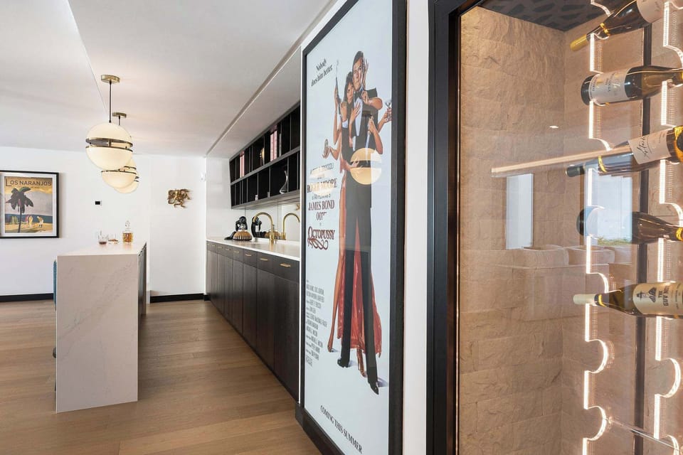 Big posture on the wall is actually a secret door to the gym and spa area 