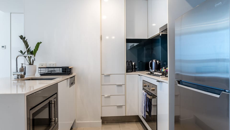 Sleek kitchen layout with ample storage and bench space