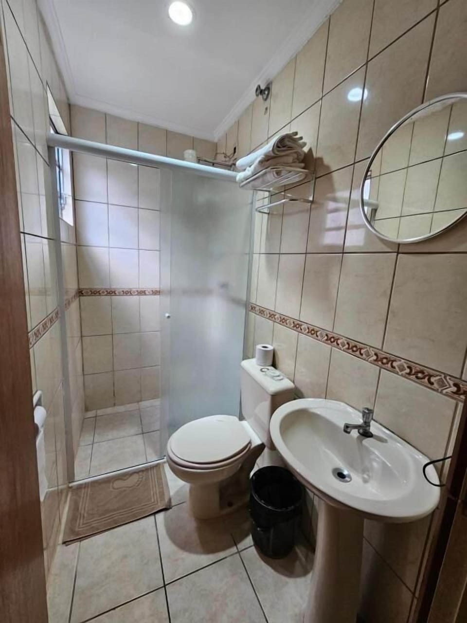 Triple Room, City View | Bathroom | Shower, hair dryer, towels, soap