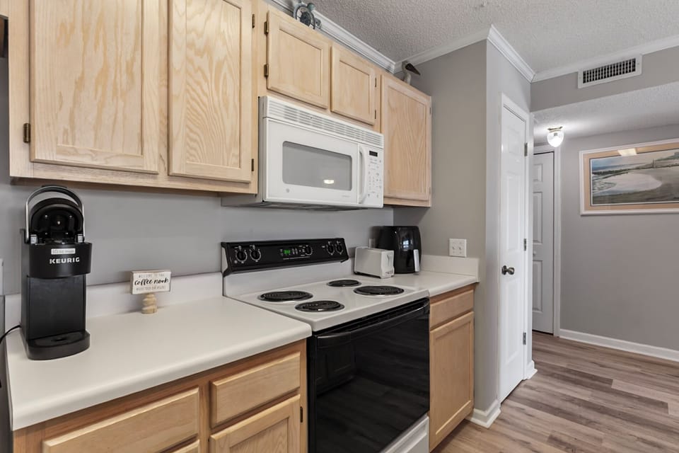 Full Kitchen with Coffee Maker, Refrigerator, Stove, Microwave, Dishwasher, and more!