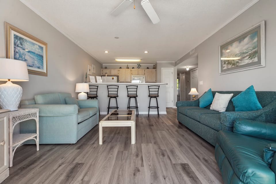 Spacious Living Area with Comfortable Seating and Flat Screen TV