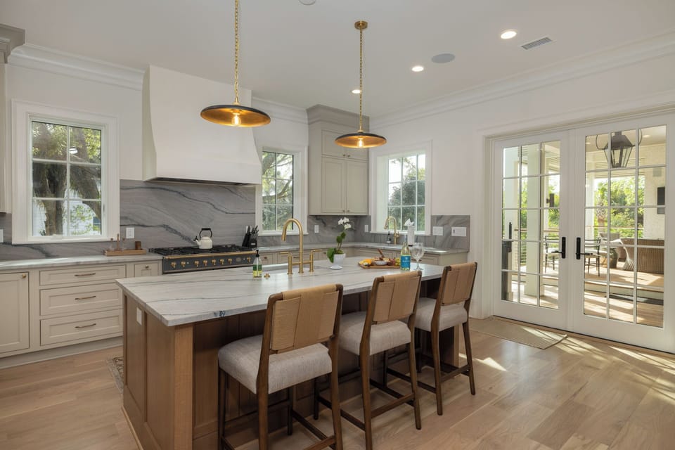 French doors take you to your outdoor dining area overlooking the pool