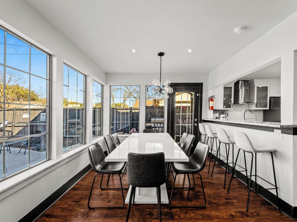 Your modern kitchen flows into a bright dining space where meals become memorable moments together.