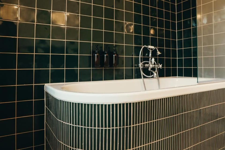 Suite, Garden View | Bathroom | Hair dryer, bathrobes, slippers, towels