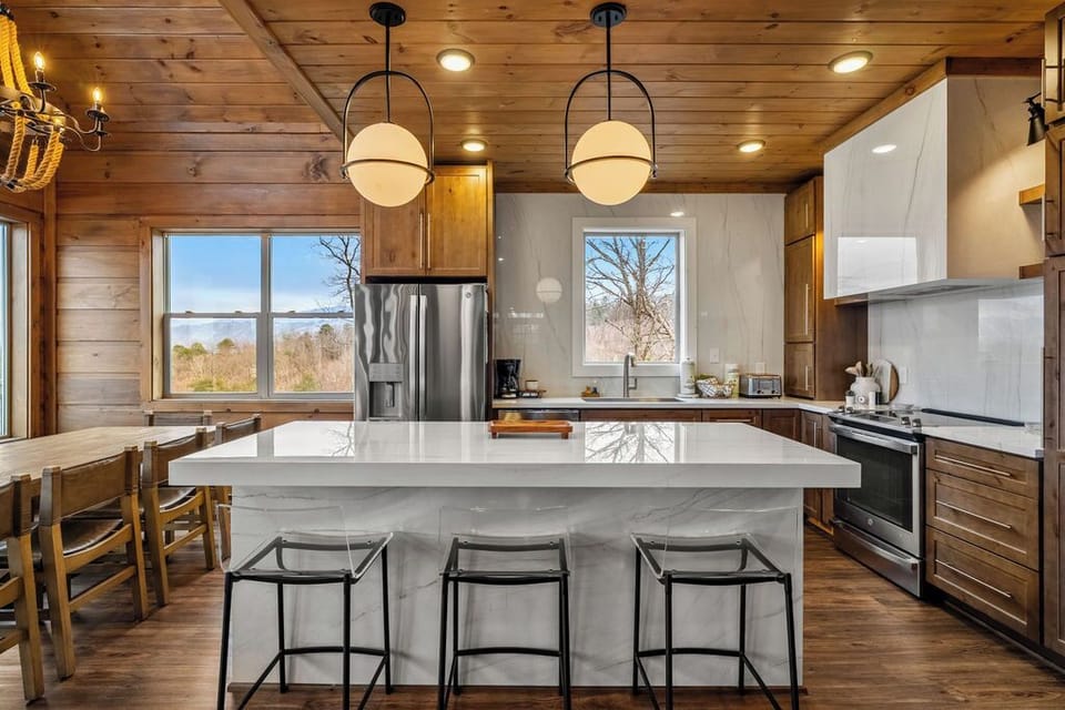 Three sleek barstools provide extra seating while adding style. 