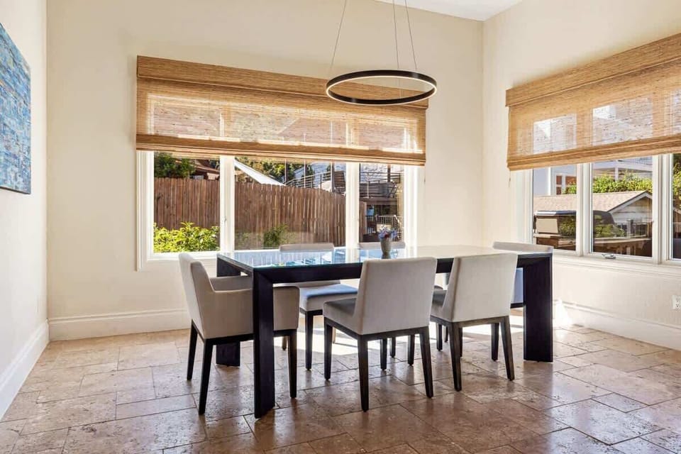 Share meals together at the dining table with seating for six. Surrounded by windows and natural light, it’s the perfect place for family dinners, game nights, or catching up over morning coffee.