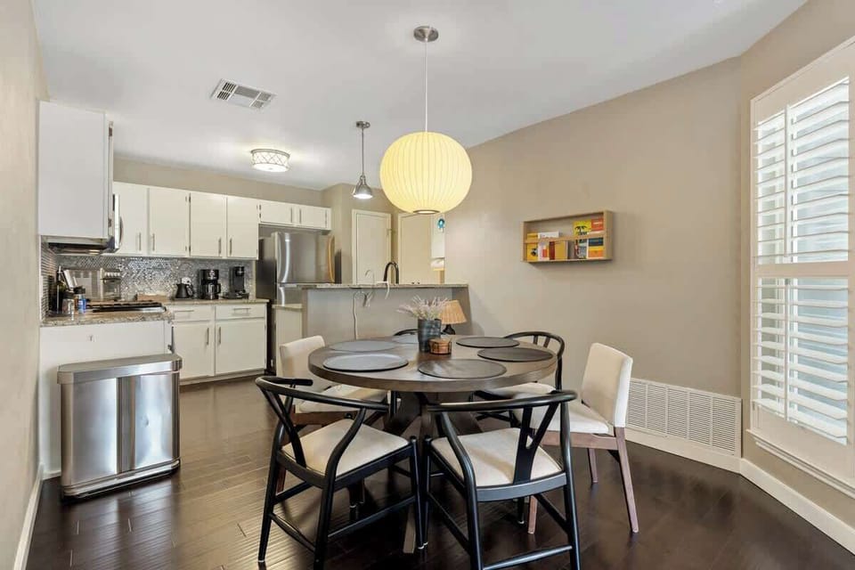 Large dining table comfortably seats six.
